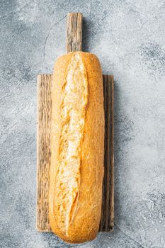 French baguette bread baked, on gray background, top view flat lay