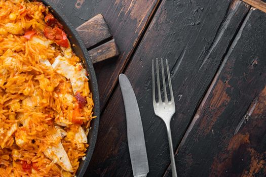 Enchilada with tomato rice, mexican recipe, on old dark wooden table background, top view flat lay with copy space for text