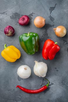 Mixed arrangement of vegetable, on gray background, top view flat lay
