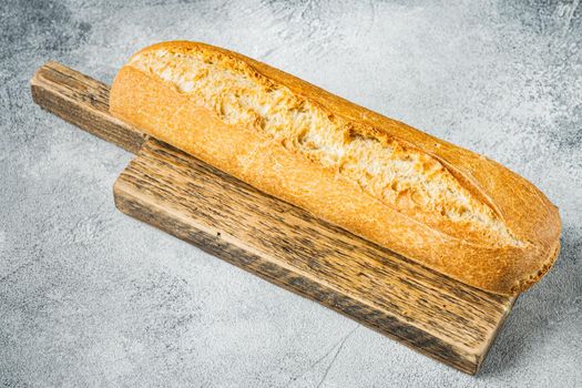 Artisanal baguette bread, on gray background