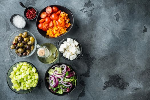Cooking Greek salad ingredient, on gray background, top view flat lay with copy space for text
