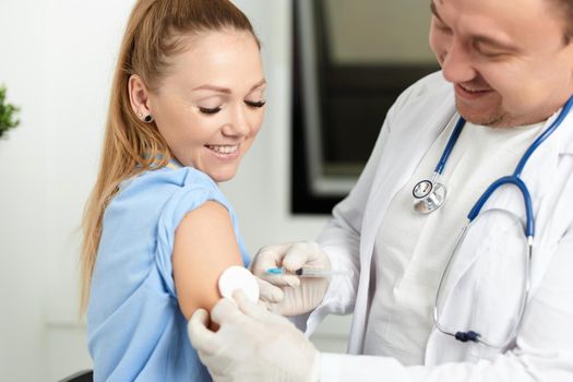 male doctor giving an injection to a patient vaccine health. High quality photo