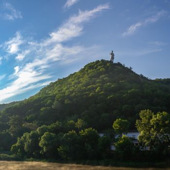 Svyatogorsk, Ukraine 07.16.2020.  Monument to Artem on the mountain above the Svyatogorsk or Sviatohirsk lavra on a sunny summer morning