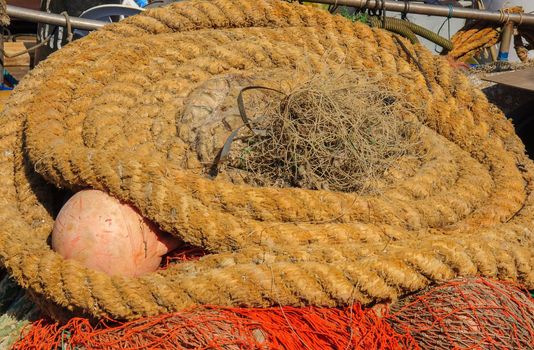 Rolls of ropes and fishing nets in a fishing harbor