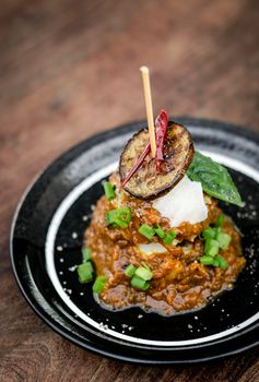 vegan quinoa cakes with sicilian roasted eggplant and spicy red pepper sauce gourmet tapas appetizer snack