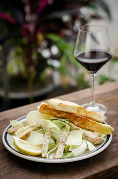 simple healthy orgaanic chicken caesar salad on wood table