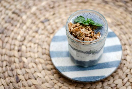 homemade healthy rustic yoghurt and granola with basil seeds breakfast snack cup