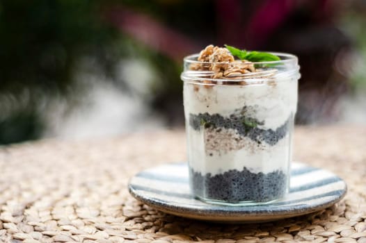 homemade healthy rustic yoghurt and granola with basil seeds breakfast snack cup