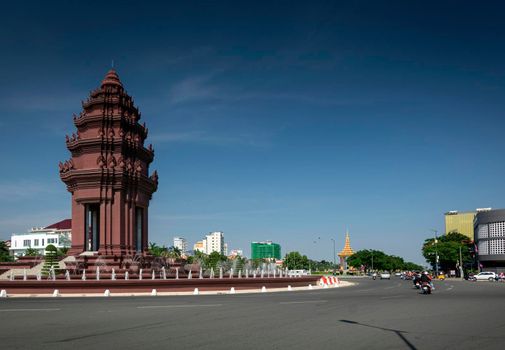 independence monument landmark on central downtown phnom penh city street in cambodia on sunny day