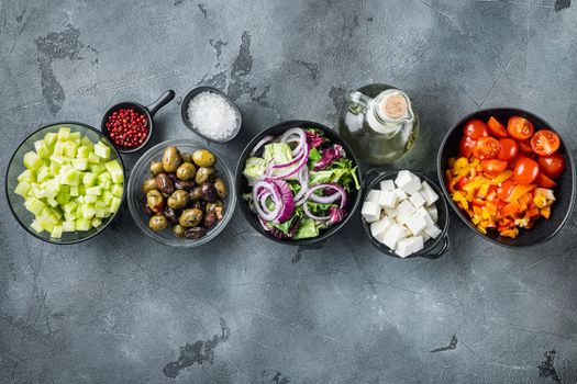 Cooking Greek salad ingredient, on gray background, top view flat lay with copy space for text
