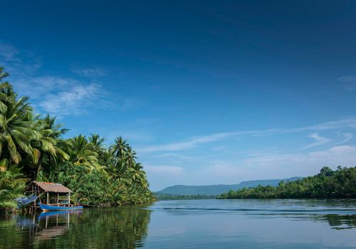 traditional boat and jungle hut on the tatai river in the cardamom mountains of cambodia