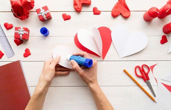 Valentines Day craft DIY. Step 5 - glue white sides of hearts to each other so they form a dimensional heart