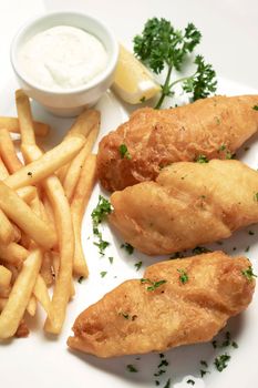 british traditional fish and chips meal on wood table