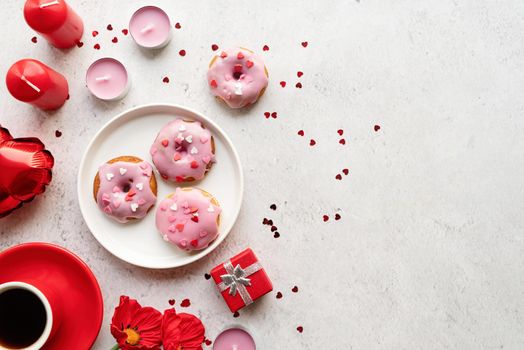 Valentine's Day concept. Pink glaze donuts with hearts