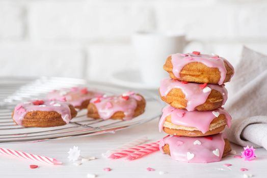 Valentine's Day concept. Pink glaze donuts with hearts