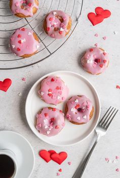 Valentine's Day concept. Pink glaze donuts with hearts