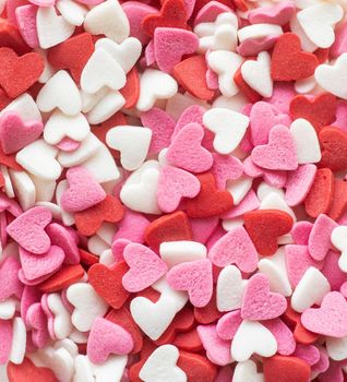 Valentines day concept. Red white and pink heart shapes sprinkles background