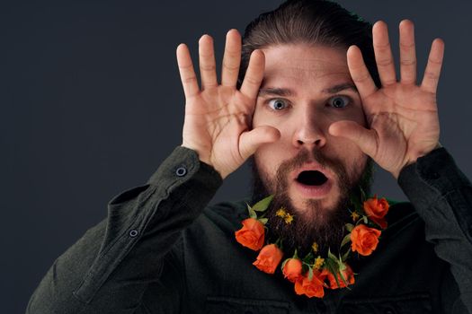 Bearded man with flowers decoration romance attractive look close-up. High quality photo