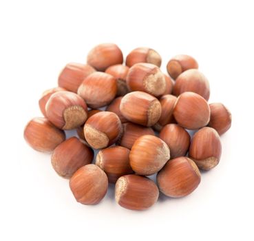 Closeup of hazelnuts, isolated on the white background, clipping path included.