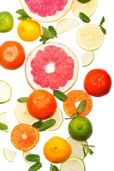 Citrus background. Fresh citrus fruits - Lemons, oranges, limes, grapefruits On wooden background