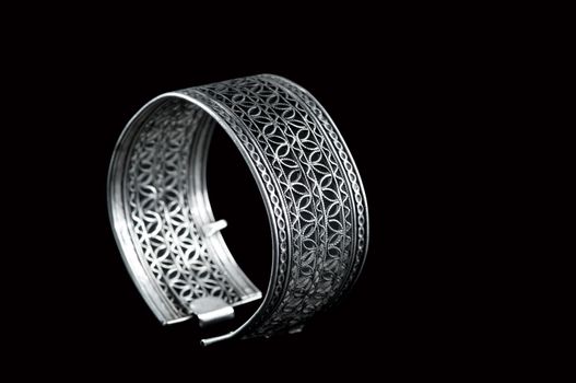 Vintage silver bracelet on black background