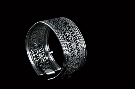 Vintage silver bracelet on black background