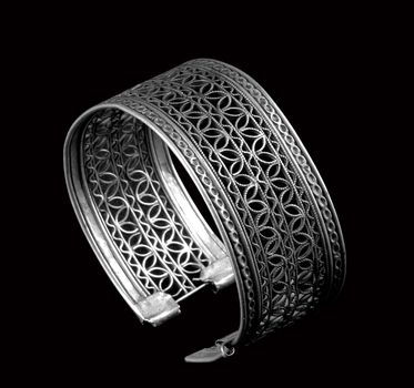 Vintage silver bracelet on black background