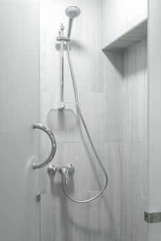 Shower cabin with a watering can, close-up