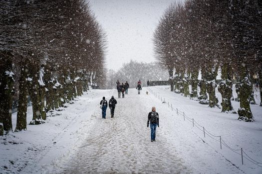 Copenhagen, Denmark - January 06, 2021: People enjoying a snowy winter day in Frederiksberg Gardens.