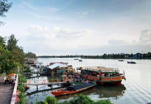 tourist restaurant boats and landscape at riverside in central kampot town cambodia