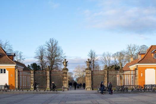 Copenhagen, Denmark - January 03, 2021: People at the main entrance to Frederiksberg Gardens.