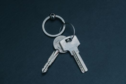 A bunch of door keys lying on the table as a symbol for various situations