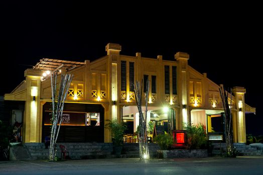 french colonial art deco old fishmarket building in kampot cambodia old town at night