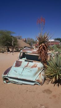 Old car wreck at Gas station Solitaire in Namibia