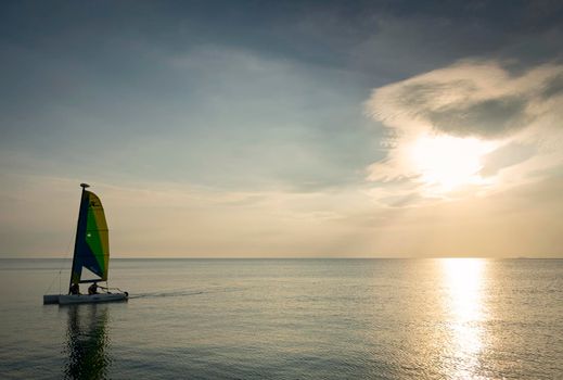 sailing boat at sea during sunset in phuket coast of thailand