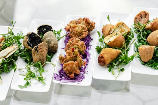 selection of traditional portuguese tapas snacks on lisbon restaurant table