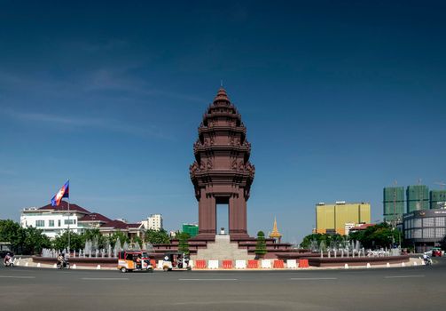 independence monument landmark on central downtown phnom penh city street in cambodia on sunny day