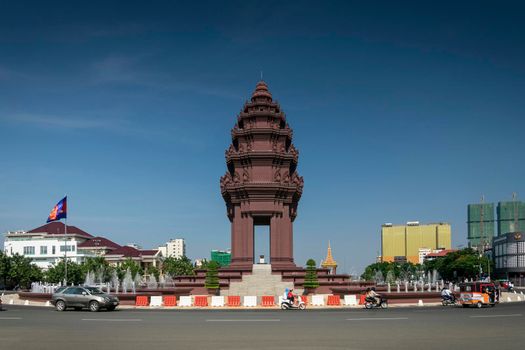 independence monument landmark on central downtown phnom penh city street in cambodia on sunny day