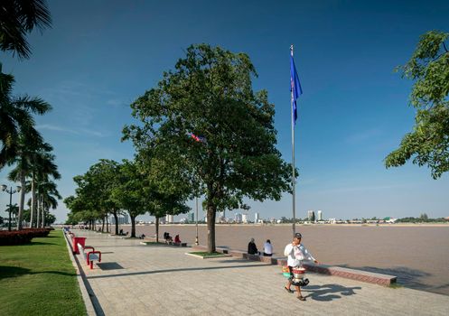 sisowath quay public riverside park in downtown phnom penh cambodia on sunny day