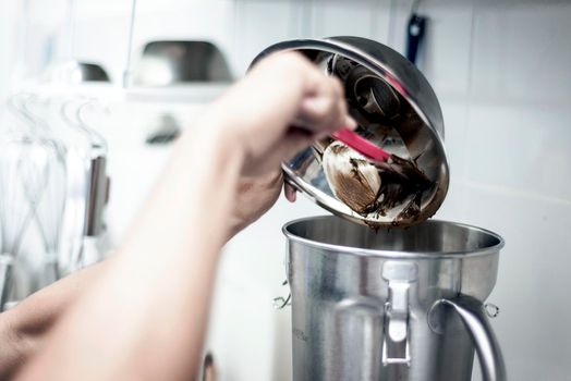 making gelato ice cream with modern professional equipment preparation detail in kitchen interior