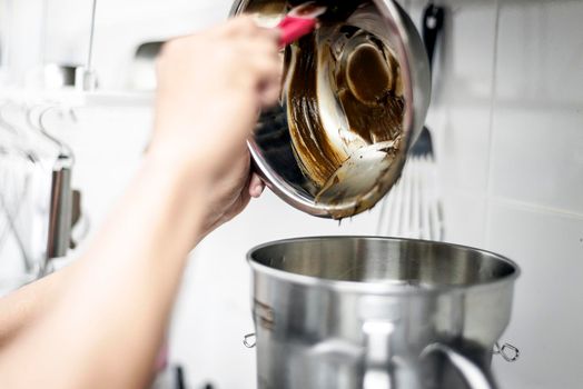 making gelato ice cream with modern professional equipment preparation detail in kitchen interior