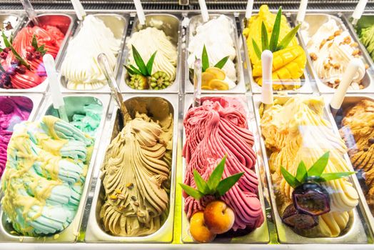 various italian gelato ice cream flavours in modern shop display window