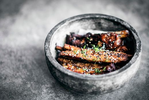 modern gourmet asian style barbeque spicy pork ribs with sweet soy sauce