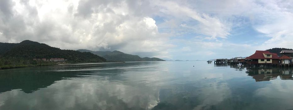 Panoramic view from Bang Bao Bay and cloud reflection in the water