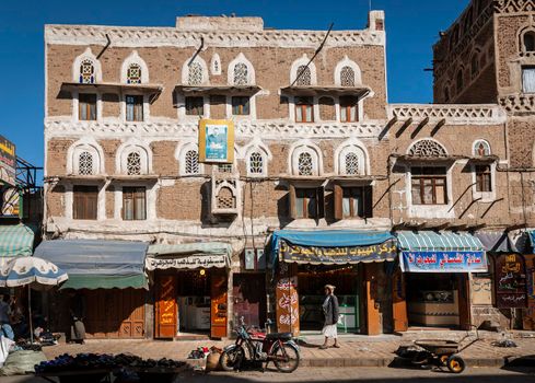 street scene and local heritage architecture buildings in old town of sanaa yemen