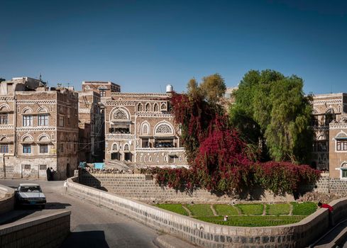 street scene and local heritage architecture buildings in old town of sanaa yemen