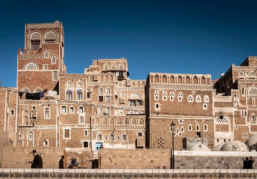 street scene and local heritage architecture buildings in old town of sanaa yemen