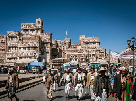 street scene and local heritage architecture buildings in old town of sanaa yemen