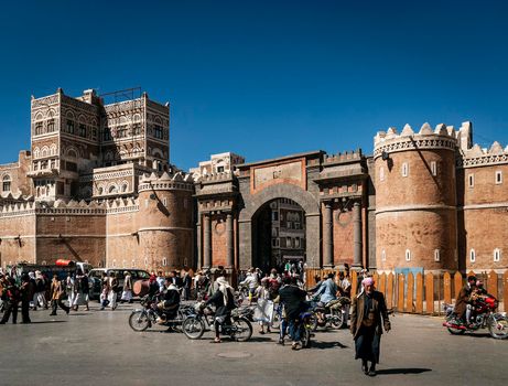 street scene and local heritage architecture buildings in old town of sanaa yemen at Bab Al Yemen gate