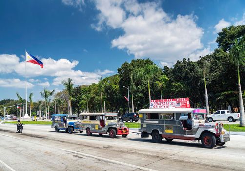 jeepney bus local transport traffic in downtown manila city street in philippines